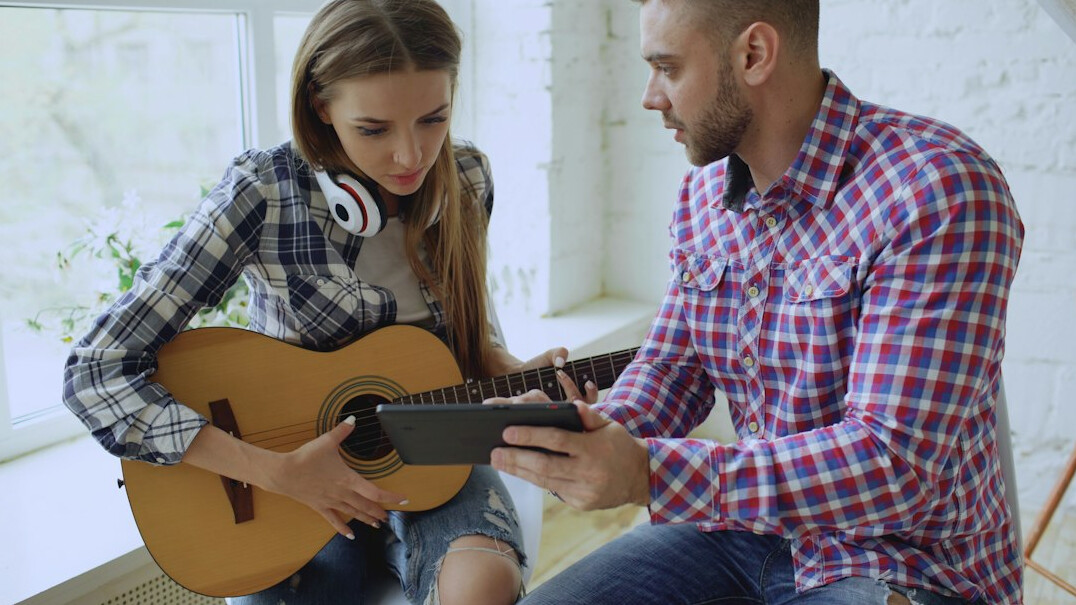 Speaking coach guiding a young student during a one on one rehearsal