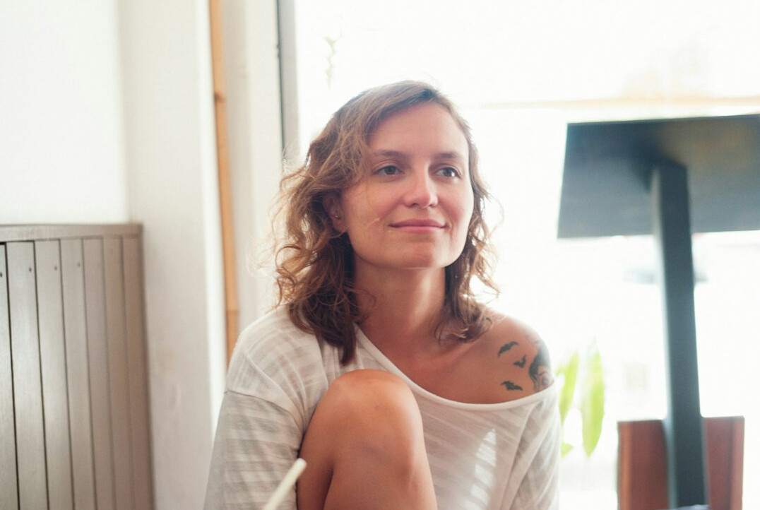 Casual portrait of a middle aged woman smiling indoors