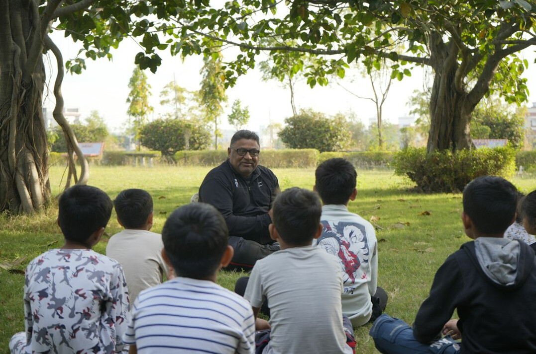 Small group workshop with a lecturer coaching students on storytelling
